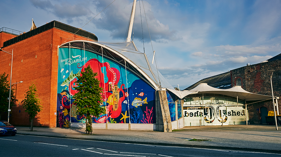 Facade of 'Bristol blue reef aquarium' in Cannon's Wharf. Bristol, Somerset at sunset.